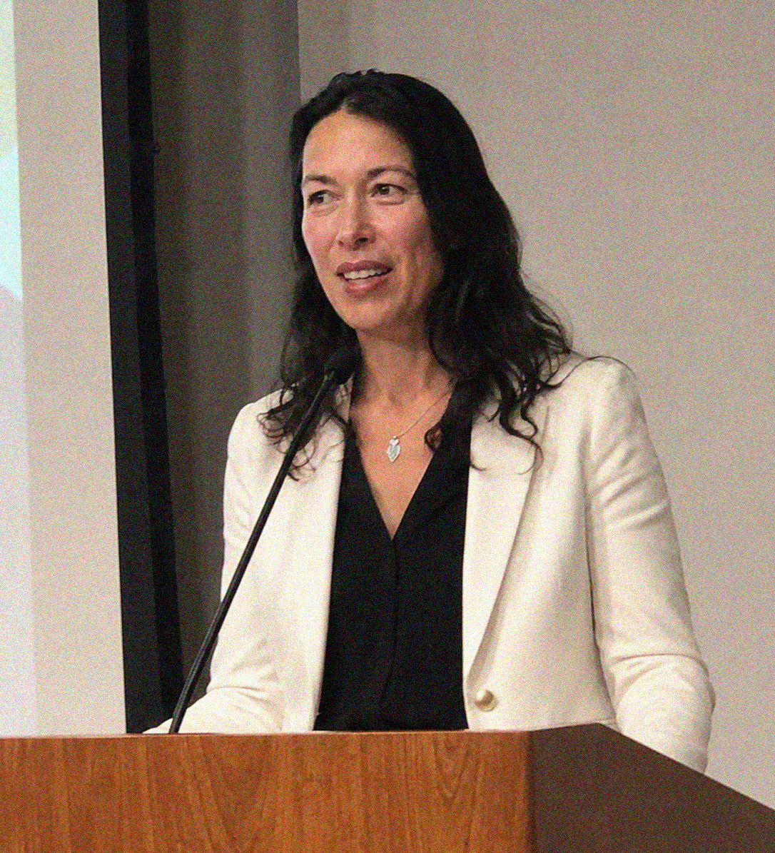 Jane speaking at a podium